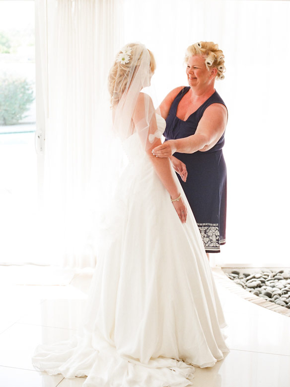 mother looks at bride and gets emotional
