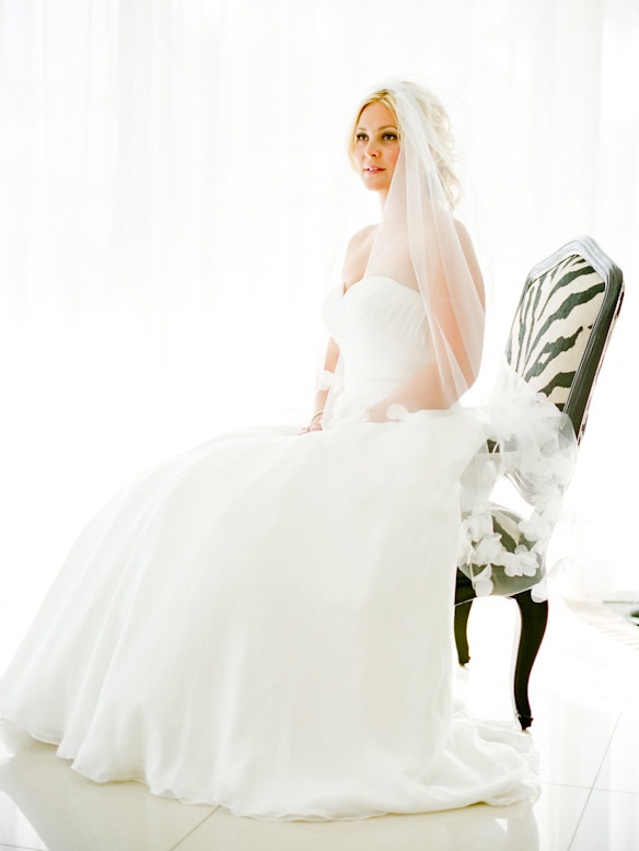 bride on zebra pattern chair in white room l'horizon wedding