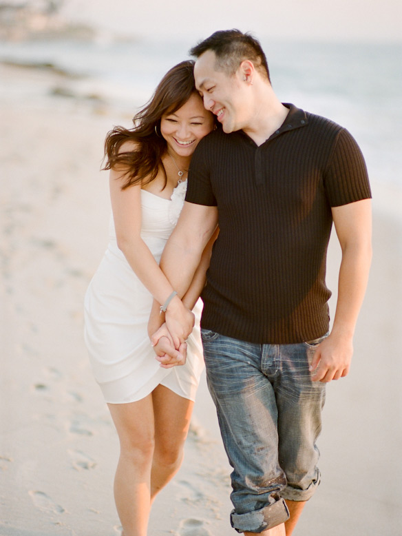 couple walking holding hands on beach la jolla elopement