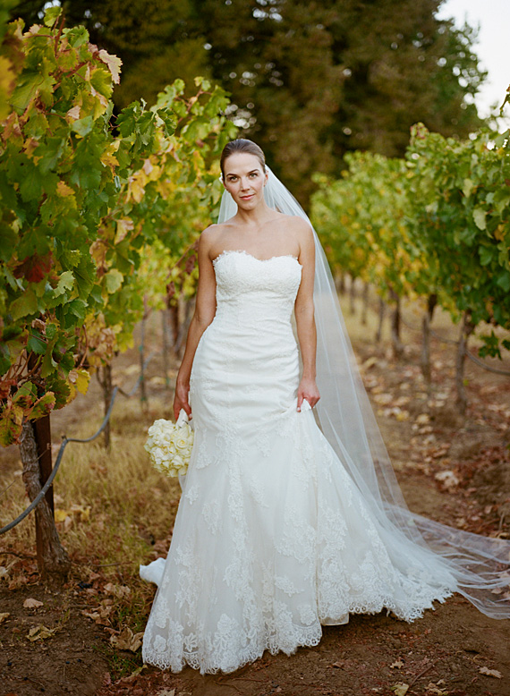 bride posing in vineyard antretti winery wedding
