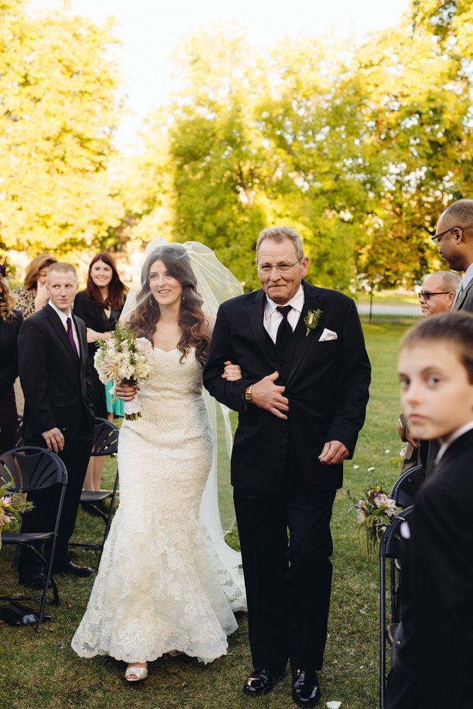 bride and father walk down aisle chicago wedding
