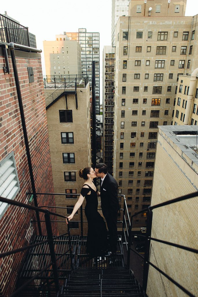 bride and groom kiss in fire escape drumbar rafaello hotel