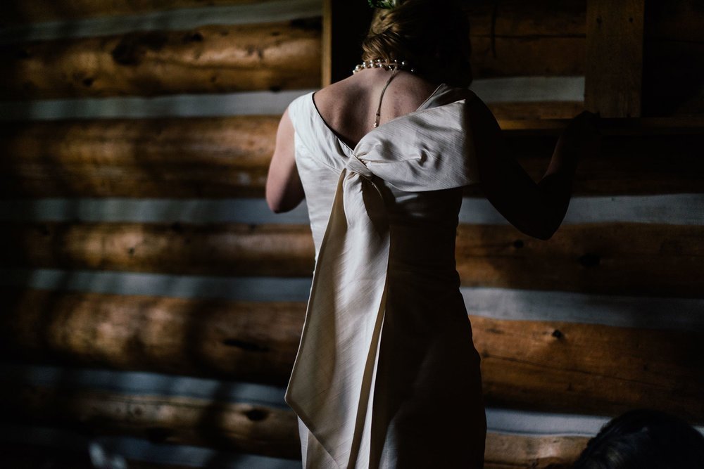 vintage wedding gown with large bow at idaho rocky mountain ranch sun valley destination wedding