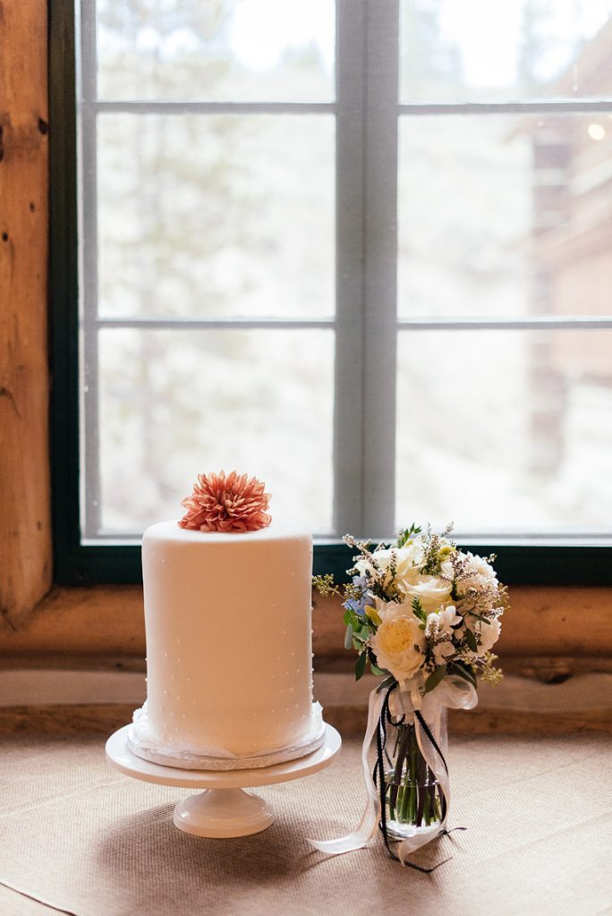 simple one tier wedding cake orange dahlia topper spring bouquet