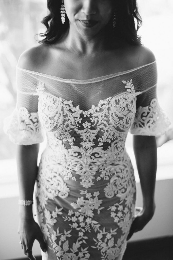 bride in lace gown before wedding