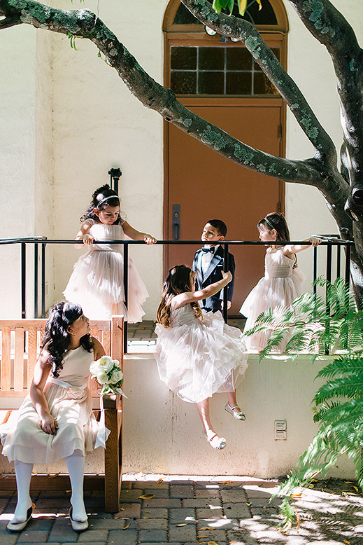 flower girls and ring bearers play outside church before portola valley wedding