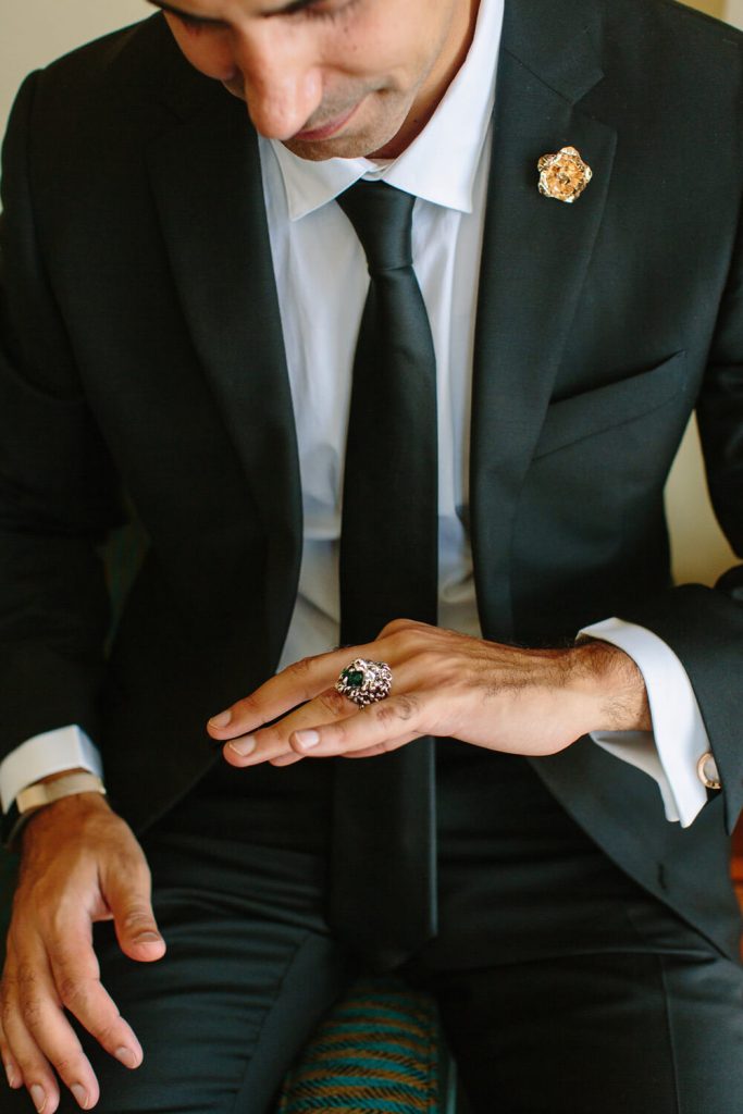 groom admires ring gift from bride