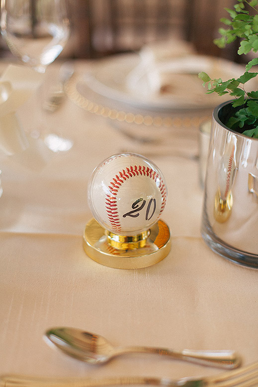 baseball in clear plastic case used as table number at portola valley wedding