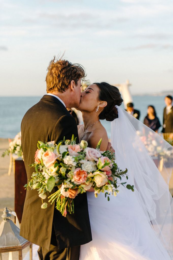 bride groom kiss sunset cliffs intimate wedding ceremony