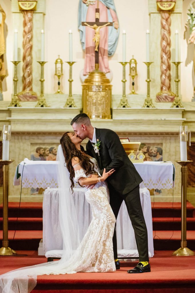 bride groom kiss altar our lady of rosary church san diego