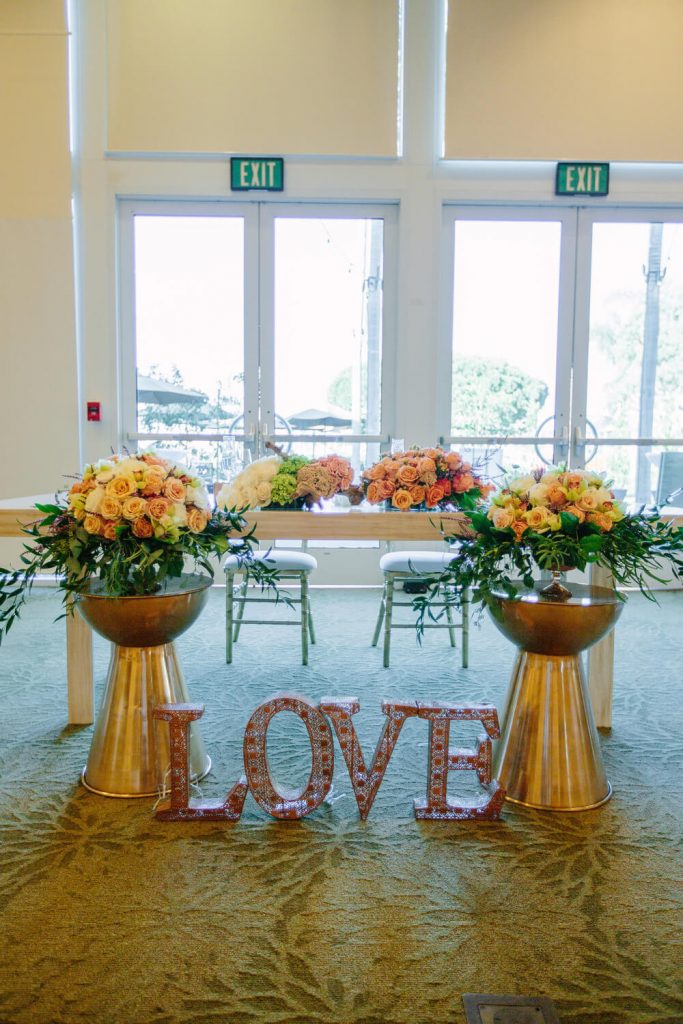 sweetheart table with flowers and love sign dana mission bay wedding