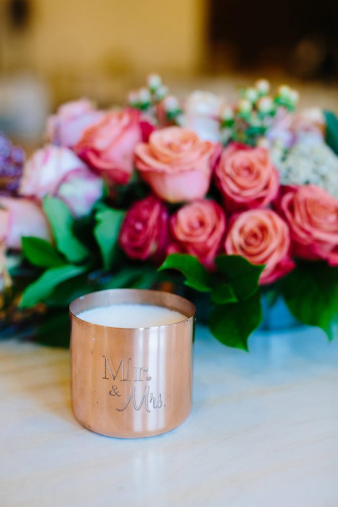 mr and mrs candle with flowers sweetheart table
