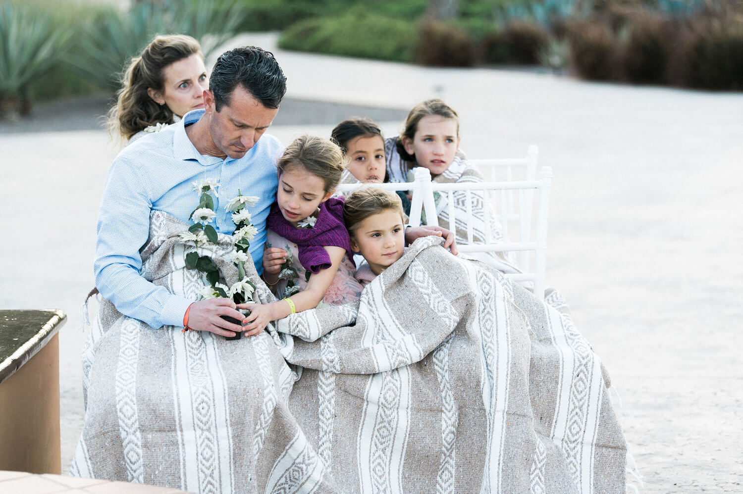 guest and children under blanket mexico winter wedding