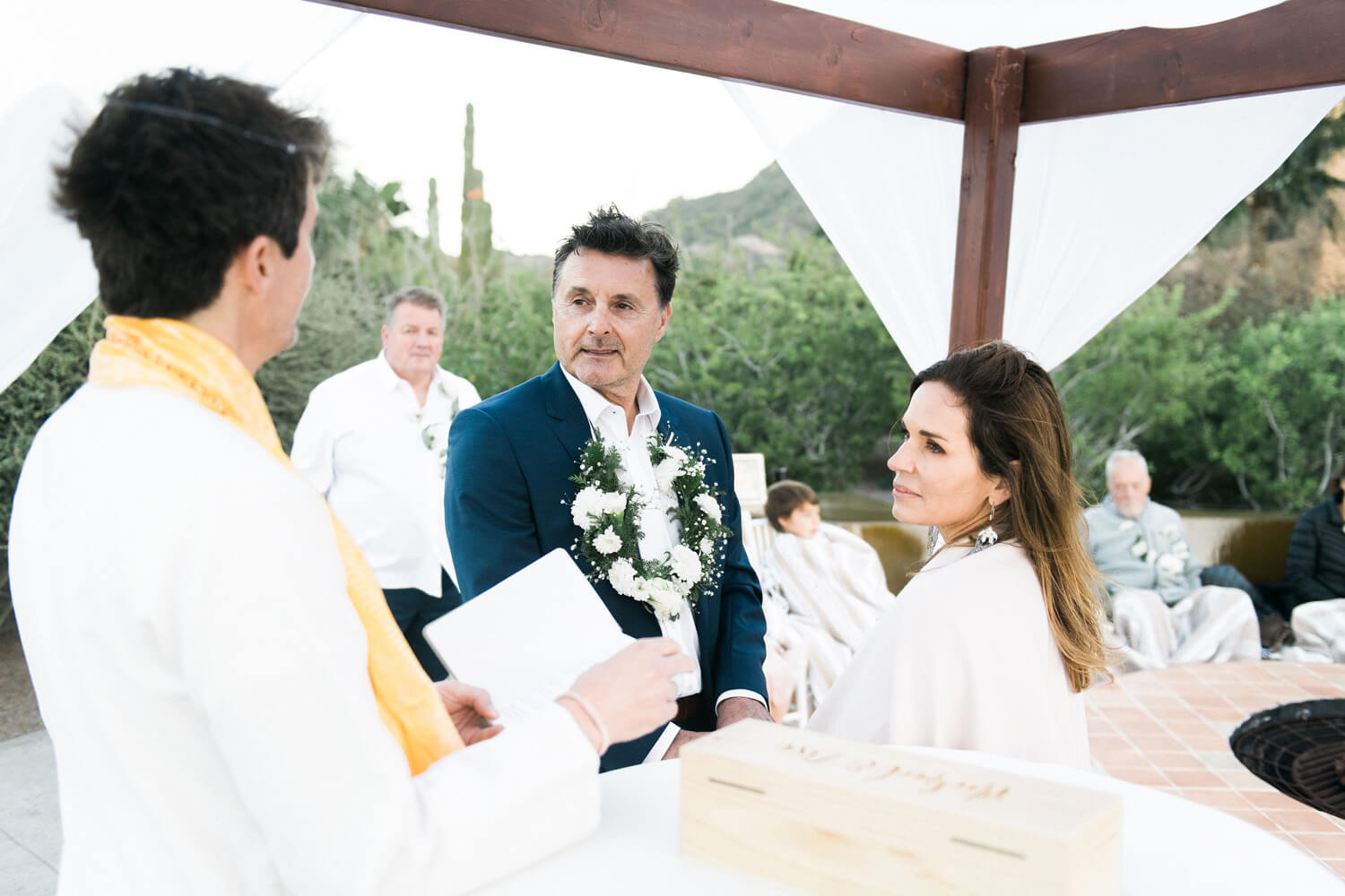 bride and groom listen to officiant villa del palmar wedding