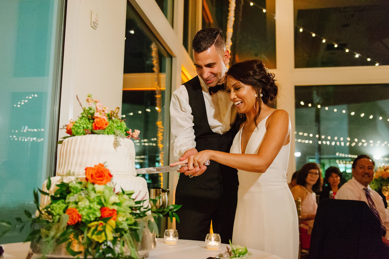 bride and groom cut cake dana mission bay wedding