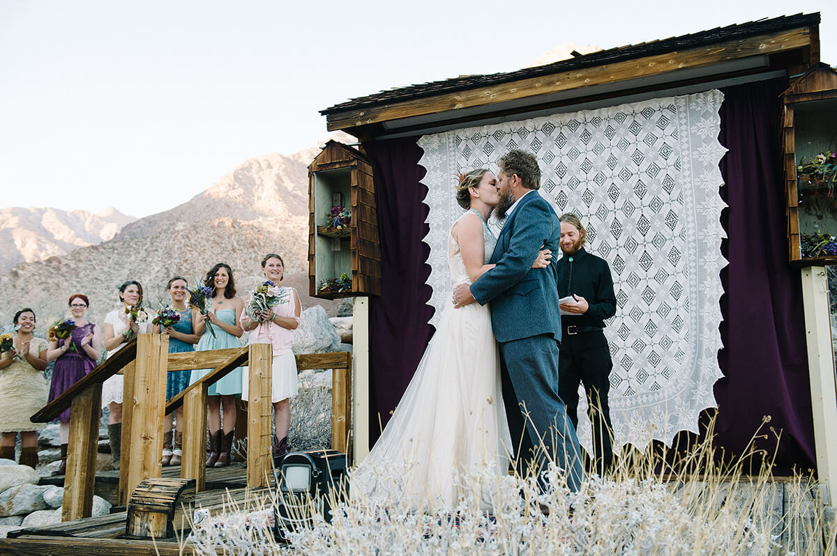 bride and groom kiss during borrego springs wedding ceremony