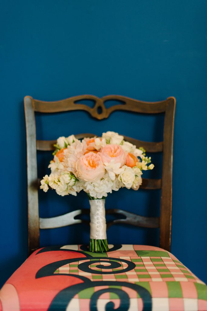 colorful bouquet resting on chair congress hall