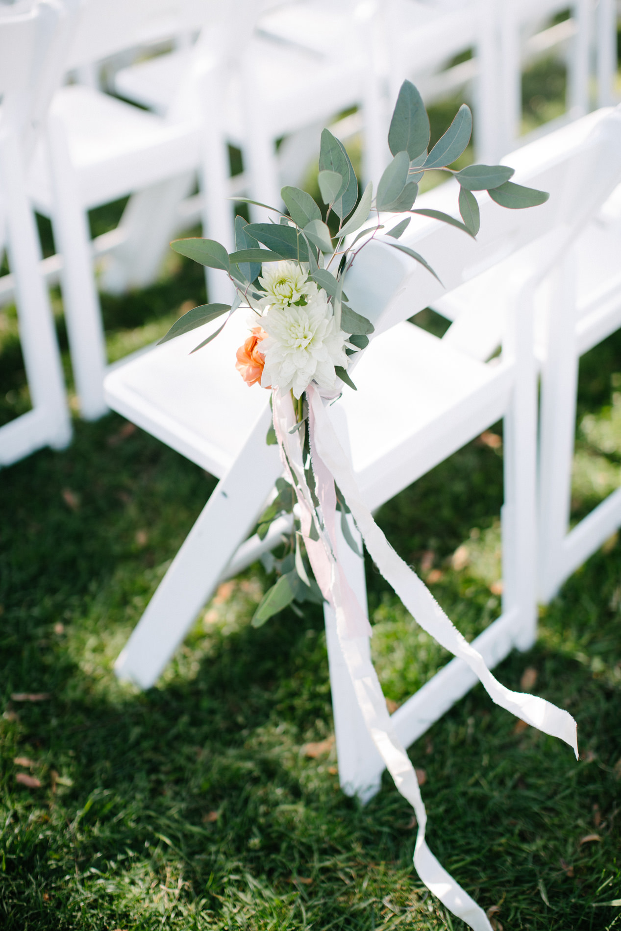 flower and ribbon tied to chair inn at rancho santa fe wedding