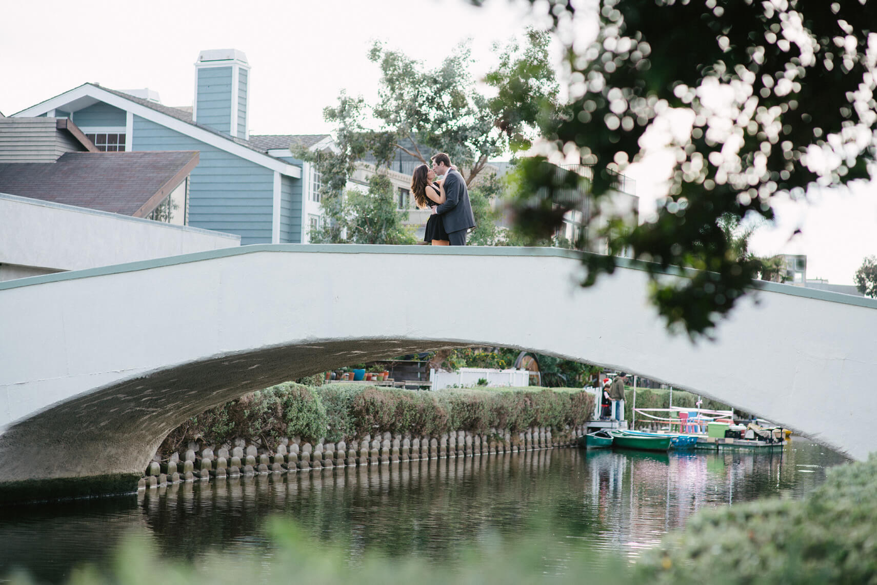 couple kissing on bridge venice canals engagement shoot