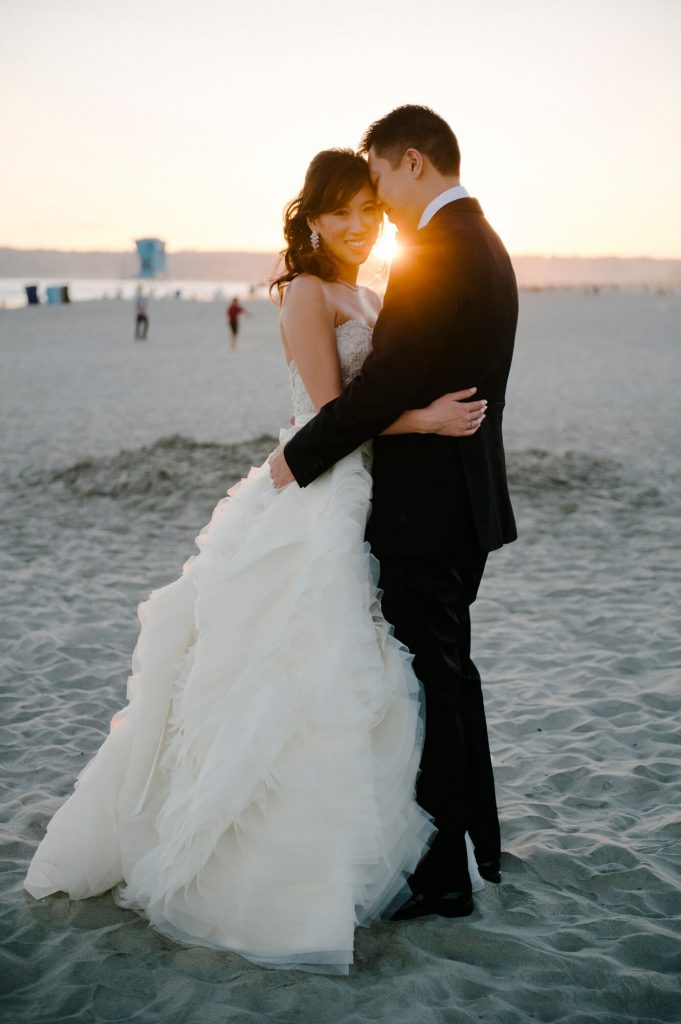 couple pose coronado beach sunset