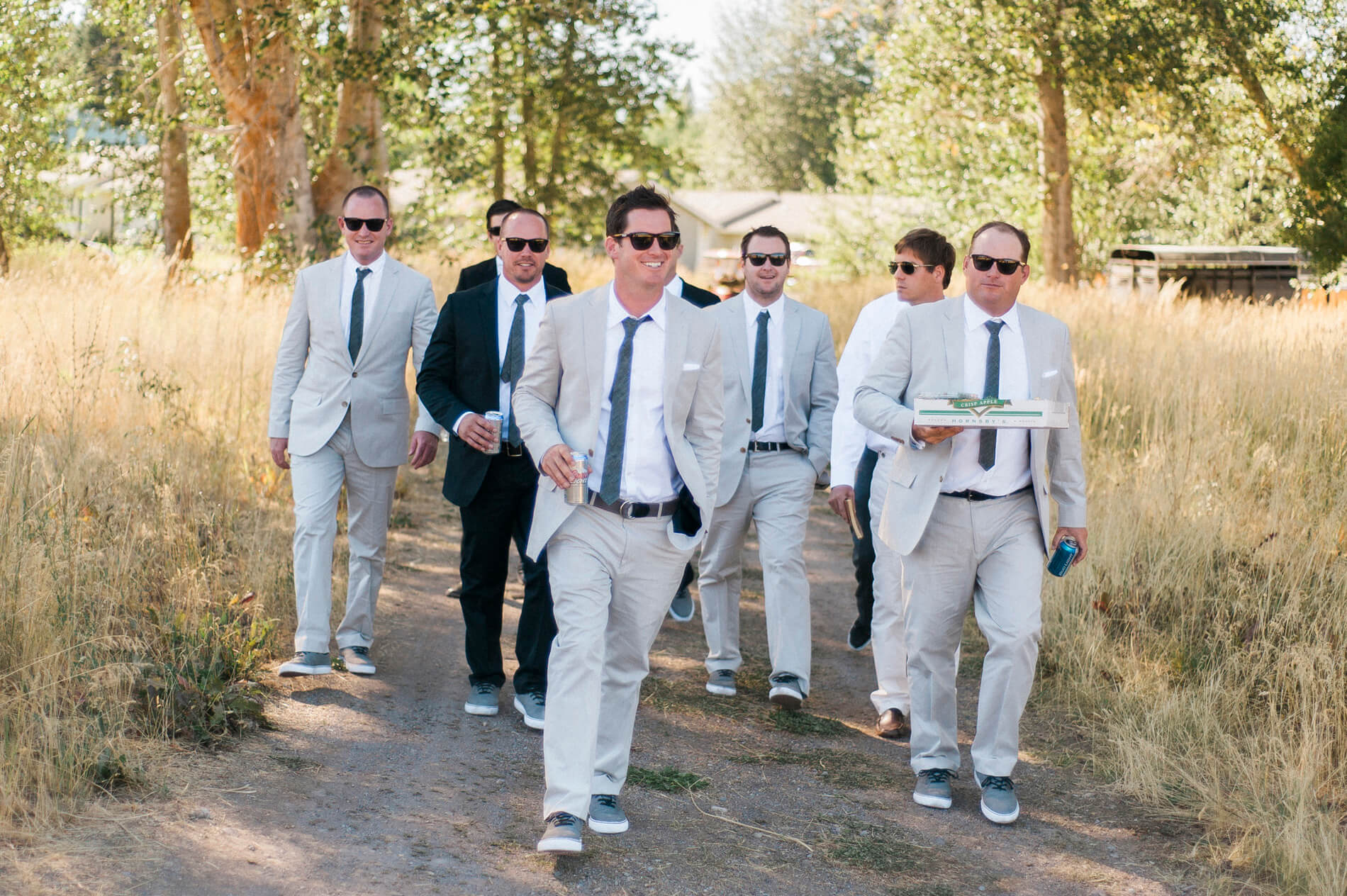 groom and groomsmen wearing tan suits white shirts and gray ties lake almanor destination wedding