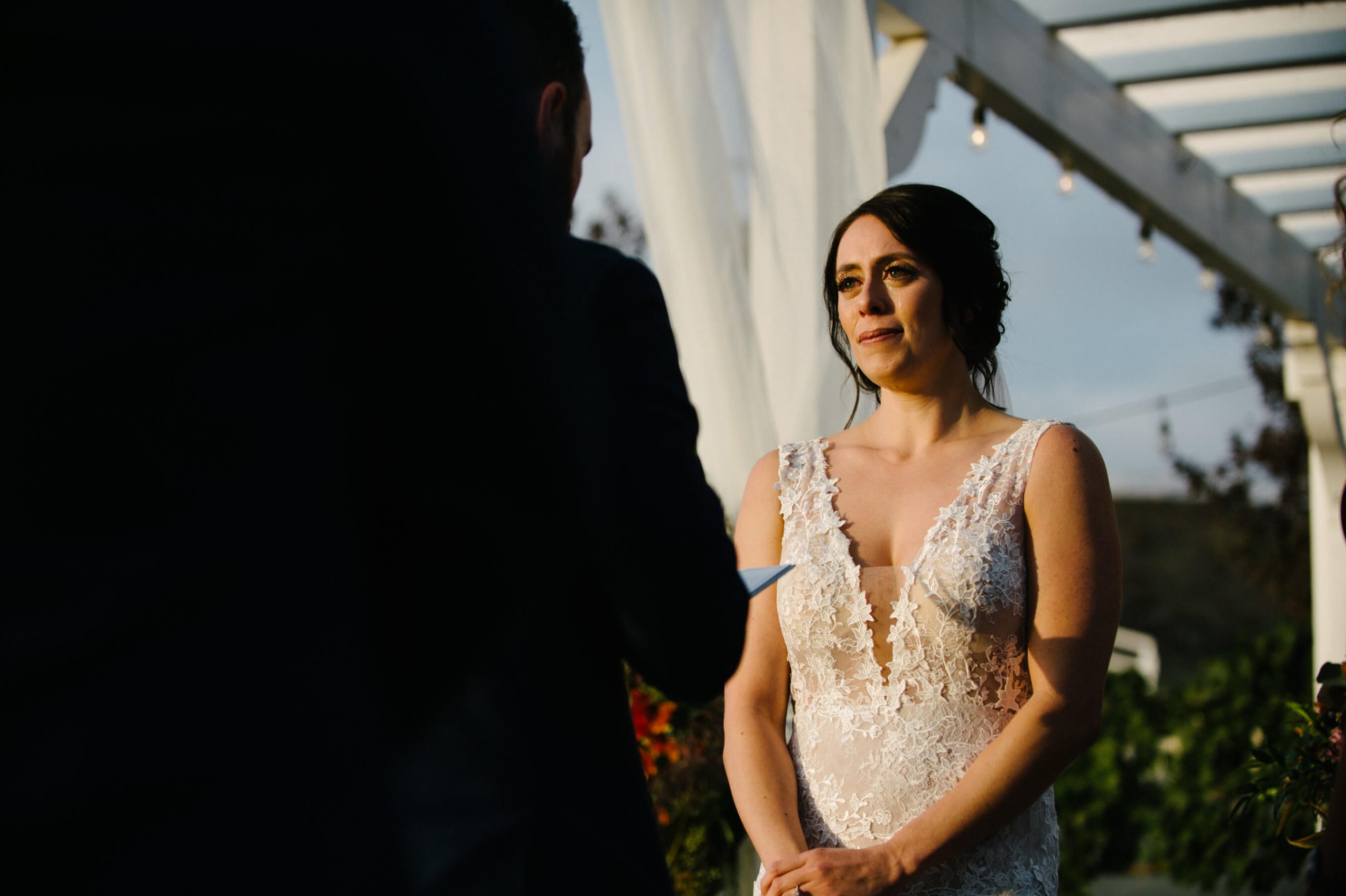 bride cries as groom reads vows leoness cellars wedding