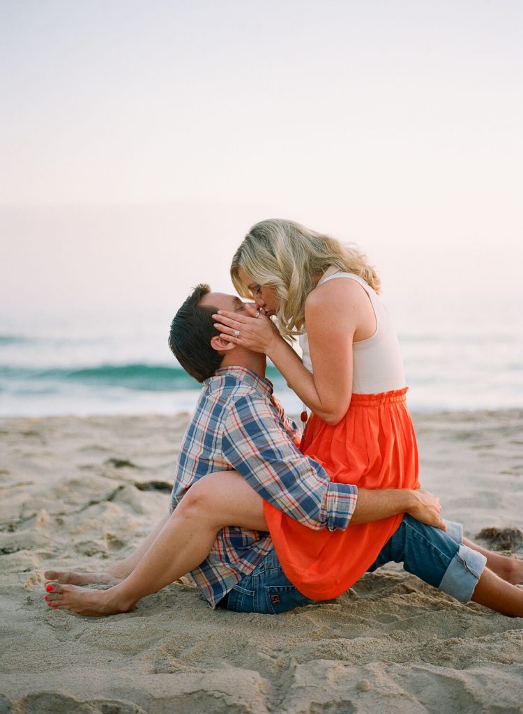 couple embracing crystal cove engagement photo