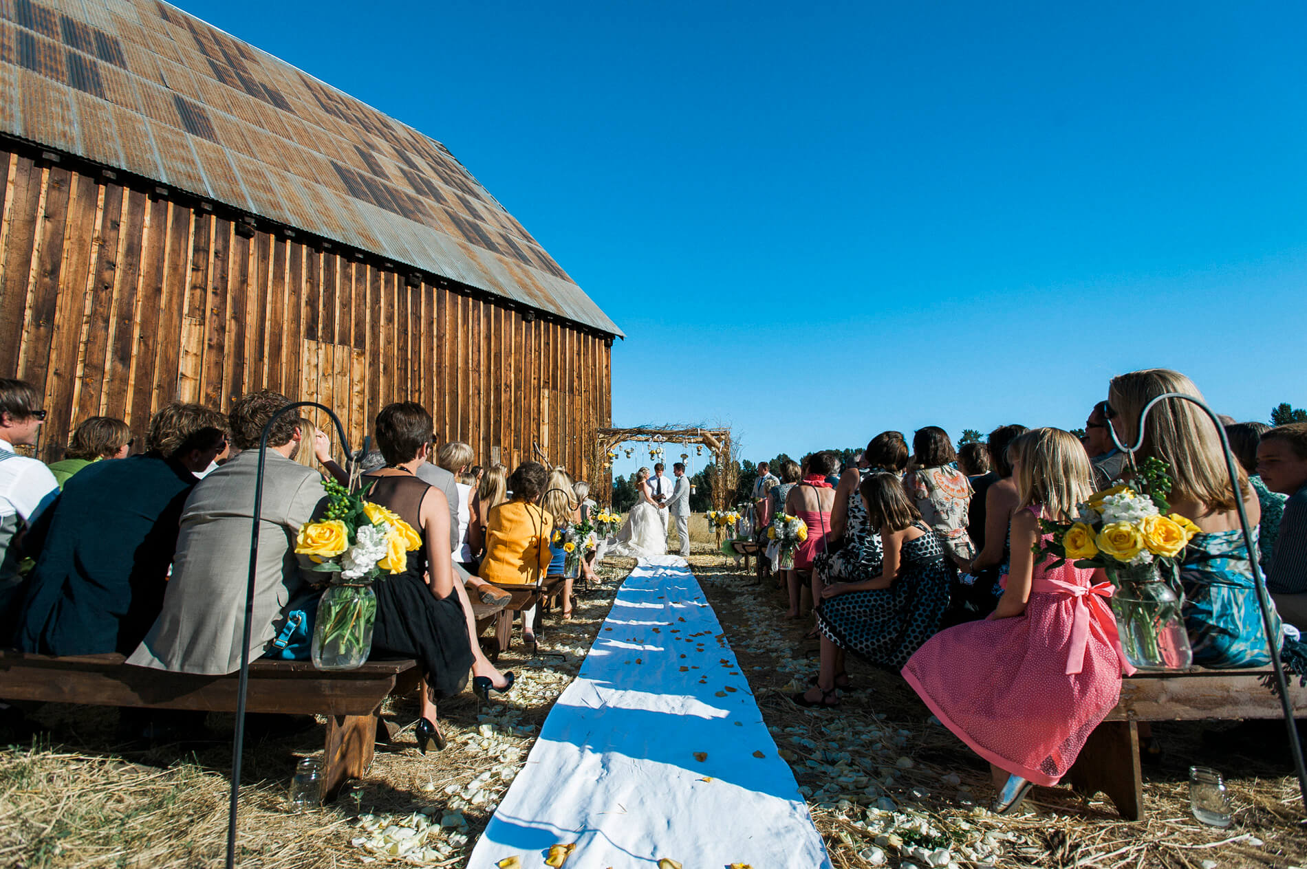 bride and groom during ceremony at rustic barn lake almanor destination wedding