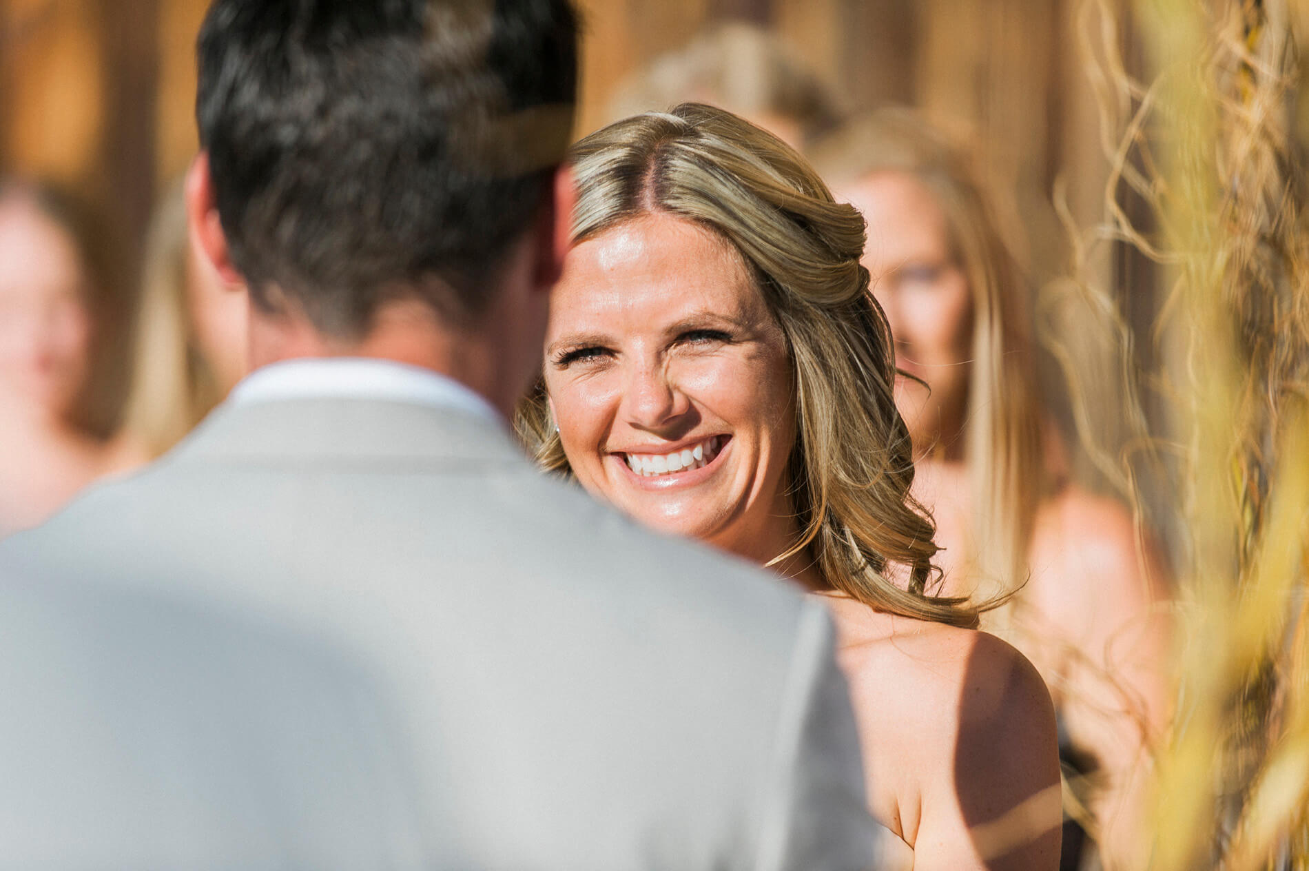 bride smiling at groom 