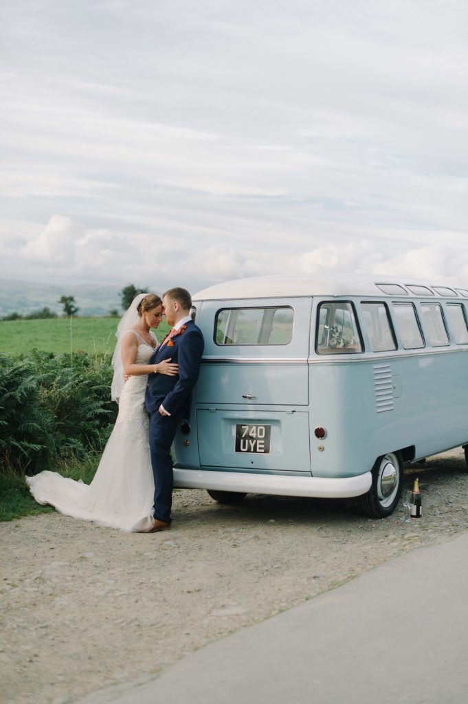 bride and groom posing near vintage vw bus kendal uk lake district wedding