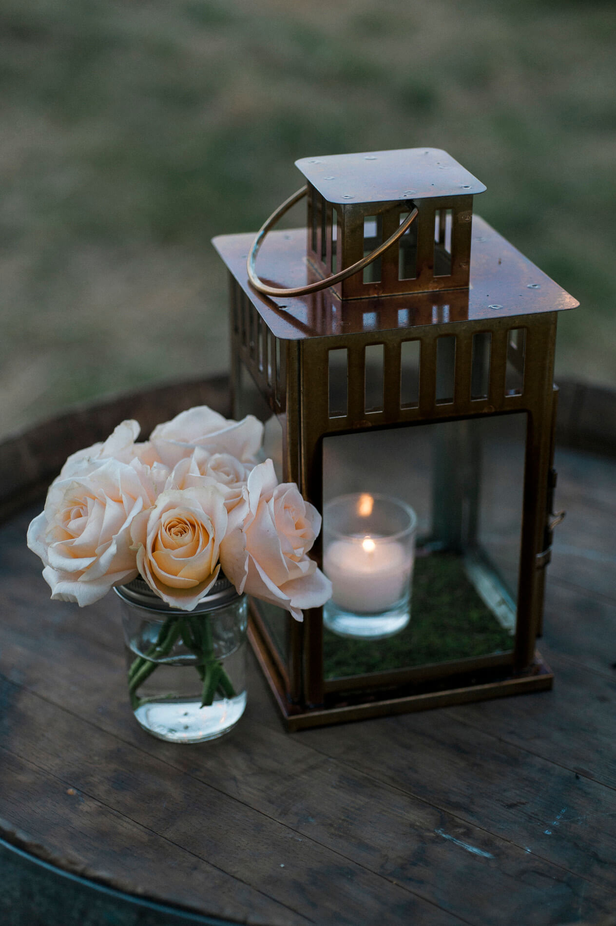rustic candle holder and flowers in mason jar 