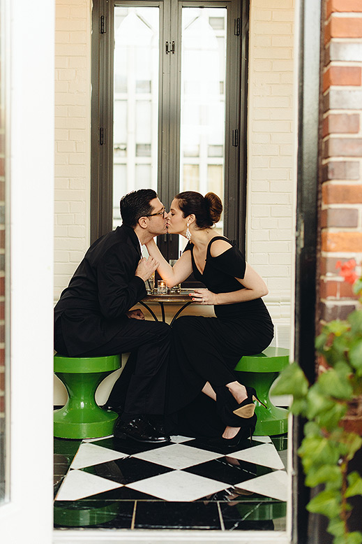 bride and groom pose in rooftop drumbar at rafaello hotel chicago