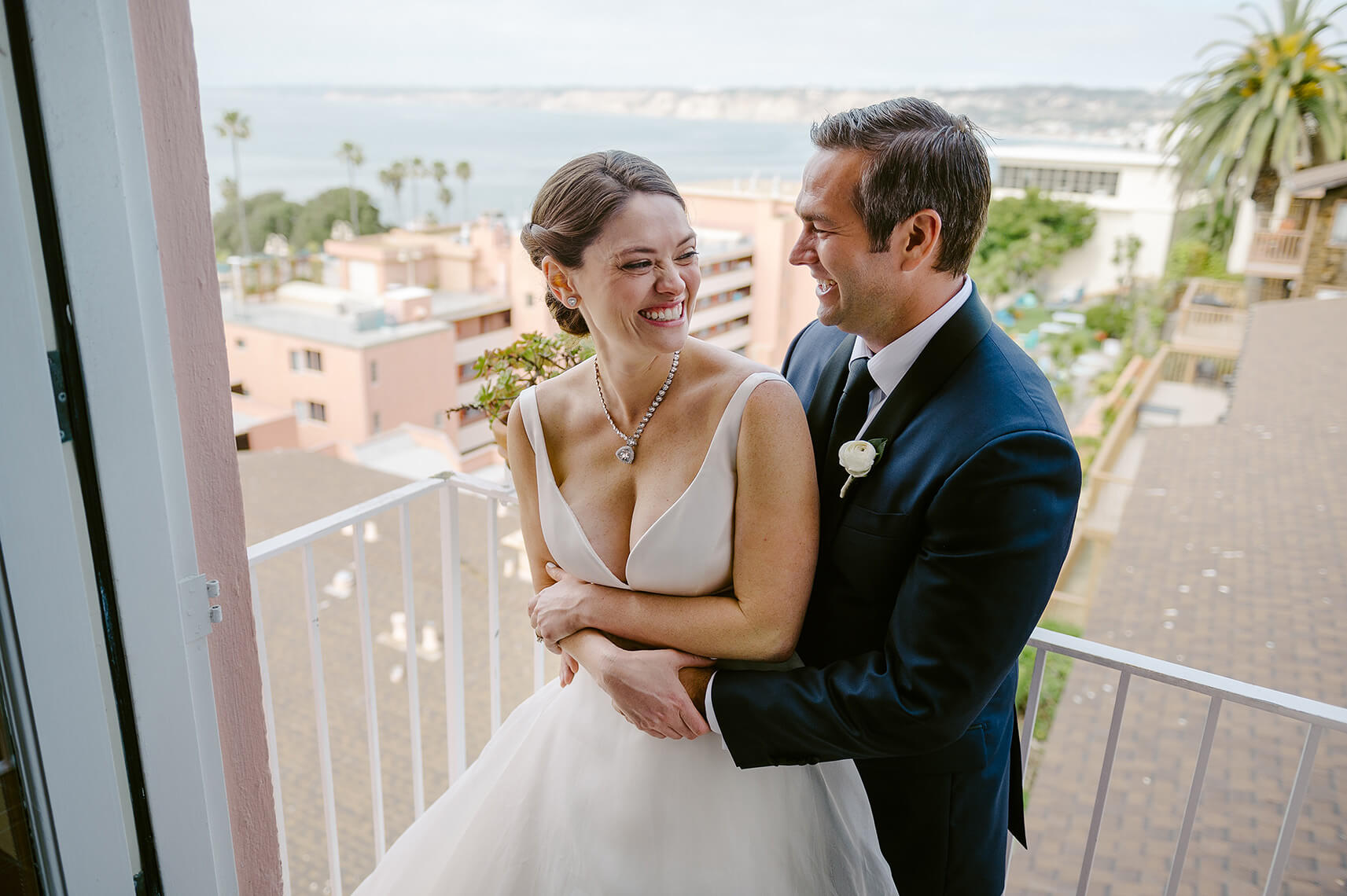 bride and groom embracing la valencia hotel wedding