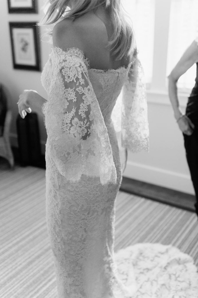 bride wearing reem acra gown