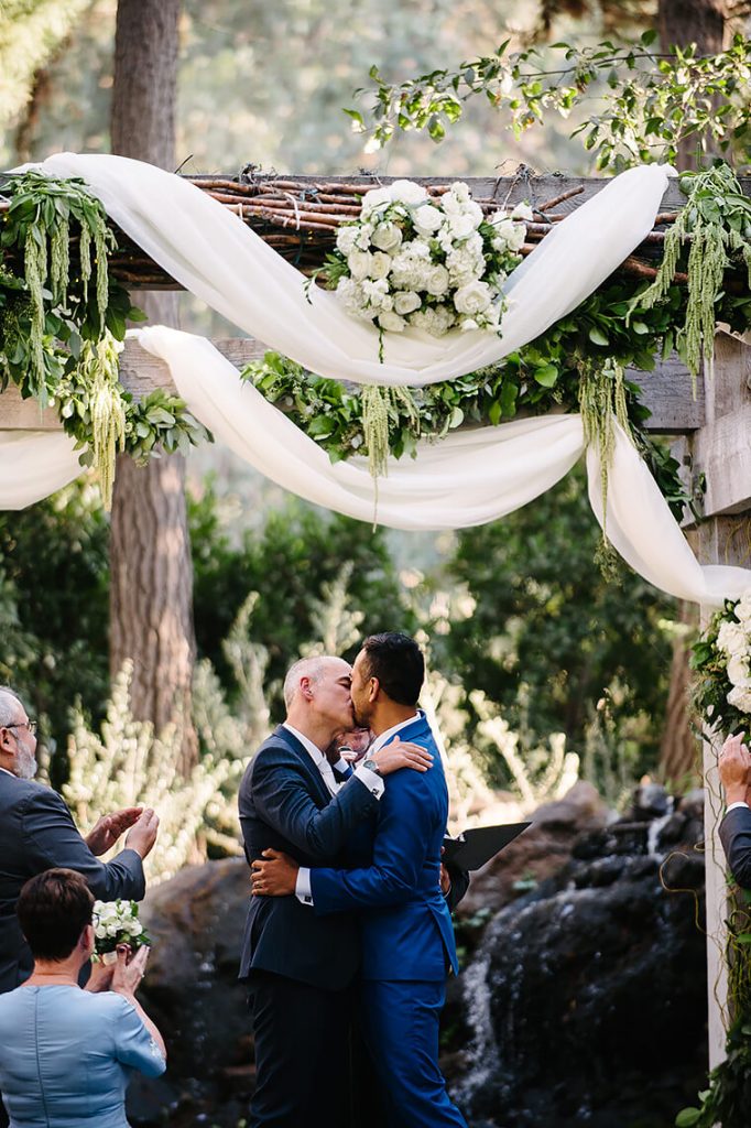 two grooms kissing same sex wedding calamigos ranch