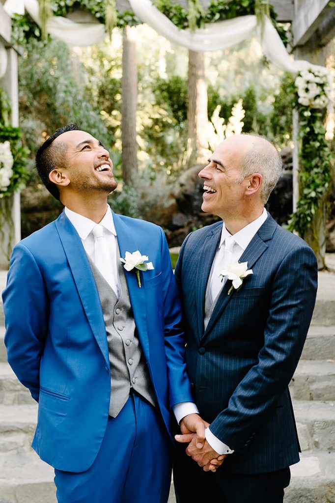 two groom laughing calamigos ranch same sex wedding