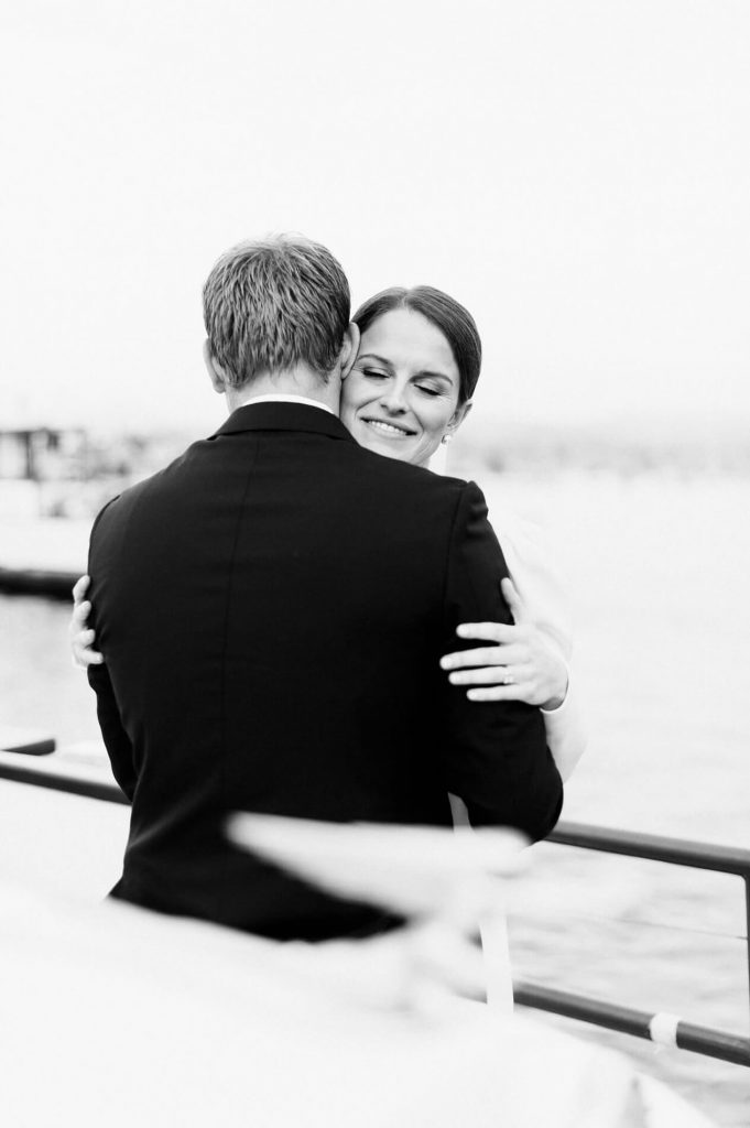 bride and groom embracing balboa island ferry