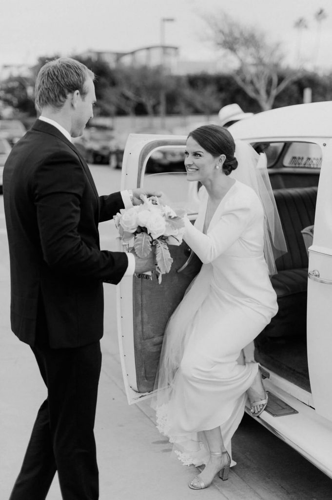 groom helping bride out of vintage rolls royce balboa island ferry
