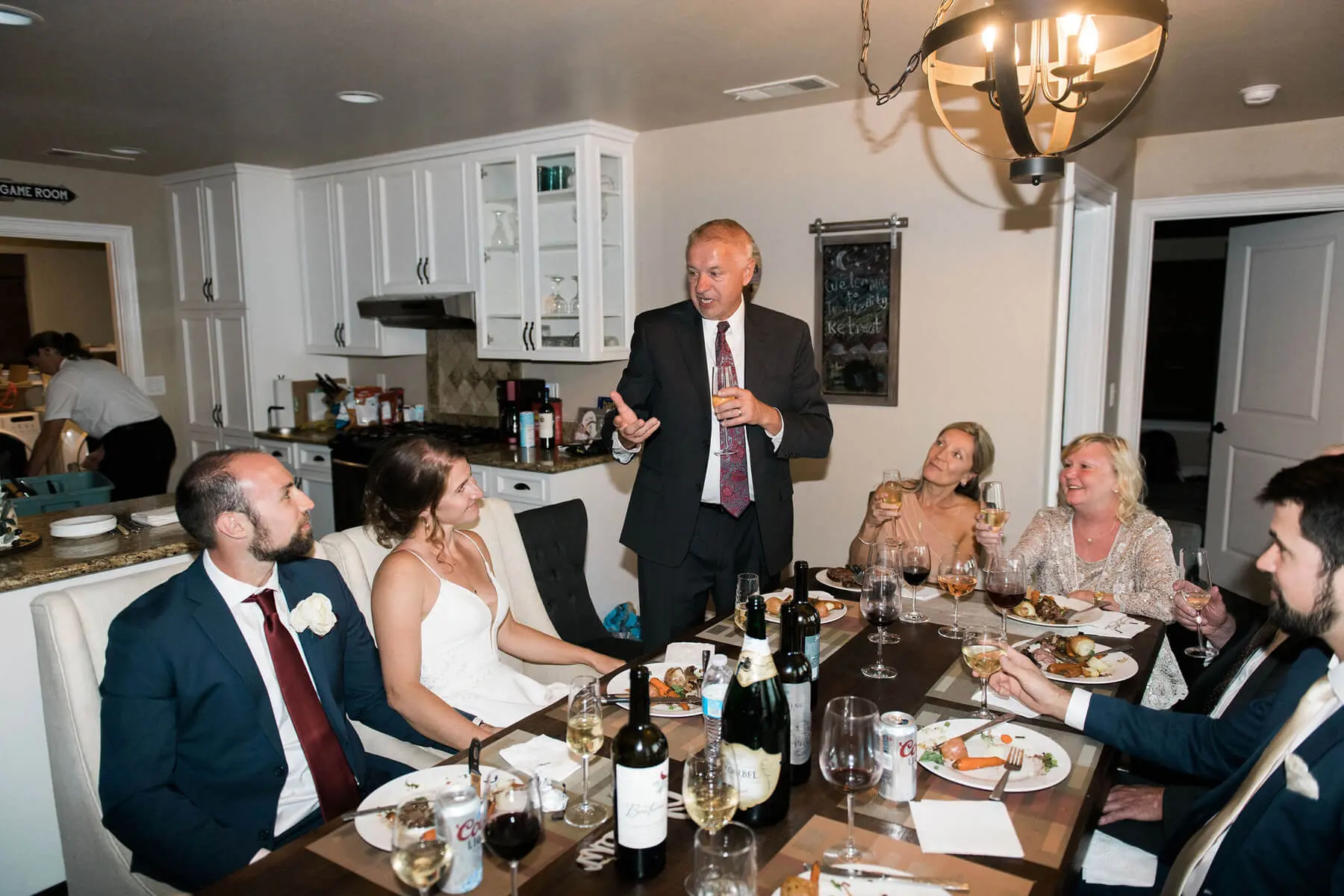 father of bride shares toast during intimate wedding reception at private residence in oakhurst california